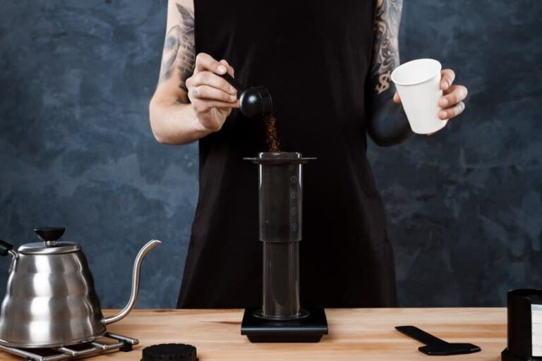 Female Barista Brews Coffee Using an AeroPress